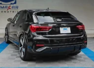 Camioneta SUV coupé de lujo Audi Q3 Sportback 2.0 S Line 180 Hp transmisión DSG automática año 2022 seminueva en color negro, vista exterior trasera en ángulo de tres cuartos izquierda exhibida en Namacar Automotriz.
