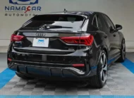 Camioneta SUV coupé de lujo Audi Q3 Sportback 2.0 S Line 180 Hp transmisión DSG automática año 2022 seminueva en color negro, vista exterior trasera en ángulo de tres cuartos derecha exhibida en Namacar Automotriz.